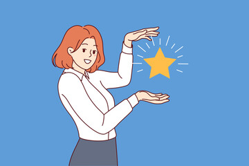 Business woman, best employee of month, received star confirming excellent skills to achieve tasks. Ambitious girl shows badge of distinction received by business after mystery shopper purchase