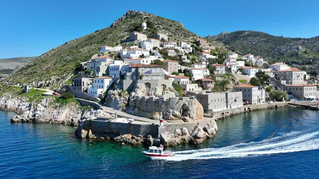 Aerial drone cinematic video of picturesque and historic main village of Hydra or Ydra island well know for captain's mansions and marine tradition, Saronic gulf, Greece
