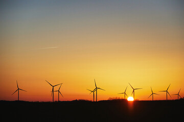 Wind turbines in the Danish countryside at sunset