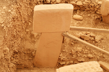 Pillar 9, one of the two central pillars in Enclosure B at the neolithic archaeological site of Göbekli Tepe, Potbelly Hill, a t-shaped pillar showing a fox, close to Sanliurfa, Turkey © Anja