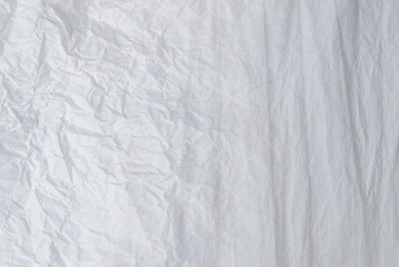 Crumpled white paper background.