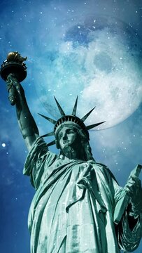 Vertical Statue of Liberty Snow Full Moon 4K Loop features the Statue of Liberty with snow falling, clouds moving and a full moon behind in a vertical ratio loop.