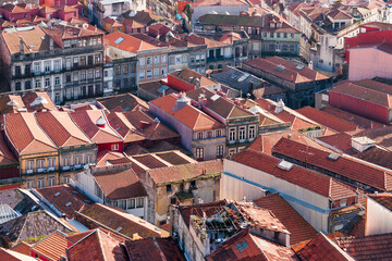 Aerial view of Porto from above. a cityscape with old orange rooftops. With old buildings and...