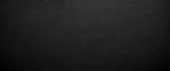 A minimalist image showcasing the raw beauty of dark grey textured concrete with soft lighting