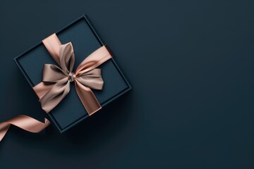 Elegant gift box with a satin ribbon on a dark background.