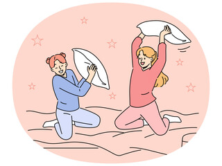 Smiling girls have fun engaged in pillow fight in bedroom. Happy children enjoy pajama party in bed at home. Vector illustration.