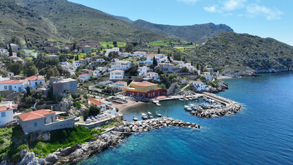 Aerial drone photo of small picturesque seaside village and harbour of Kaminia located near main village of Hydra island accessible by footpath, Saronic gulf, Greece - obrazy, fototapety, plakaty