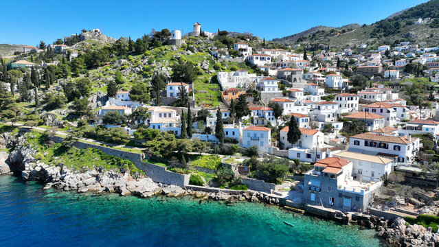 Aerial drone photo of small picturesque seaside village and harbour of Kaminia located near main village of Hydra island accessible by footpath, Saronic gulf, Greece