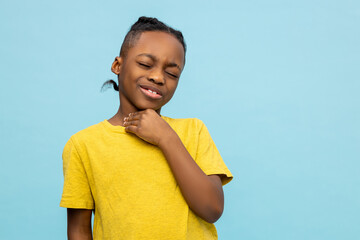 African American little boy catching cold has sore throat