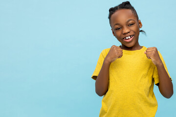 Joyful African American little boy celebrating victory - 791952901