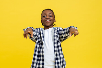 Smiling african american boy in checkered shirt looking happy