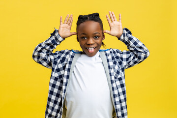 Boy in checkered shirt looking funny and happy