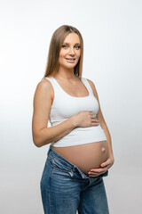 Cute pregnant woman with long hair on a white background