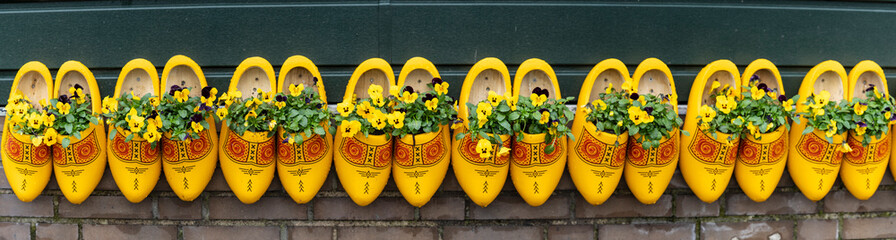 traditionally decorated yellow clogs, Zaanse Schans, Zaanstad Municipality, European Route of Industrial Heritage, Netherlands - obrazy, fototapety, plakaty