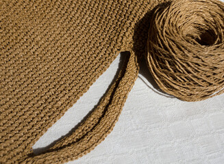Knitting a raffia bag. Crocheted bags, clutches, hats, wallets. Eco material for handmade work.