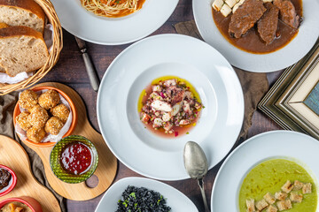 Table full of food: A bountiful spread of various dishes and delicacies, offering a feast for the...