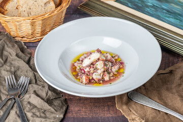 
Octopus salad: A refreshing dish featuring tender octopus pieces marinated in olive oil, lemon juice, garlic, and herbs