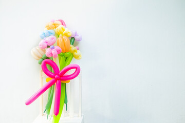 Balloons twisted into a blossoming flower bouquet on white background,Flowers Balloon to decorate the place,bouquet with colorful balloon flowers.