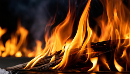 Close-up of fire flames on black background. Intense blaze.