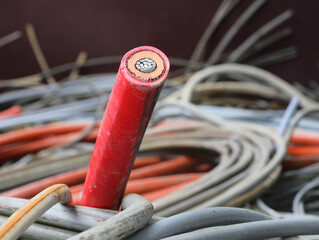 red high-amp electrical cord in scrap metal recycling center