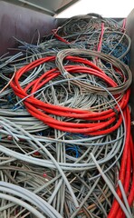 High-voltage power cable and other copper wires in recycling container at the authorized landfill
