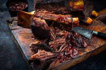 Traditional barbecue burnt chuck beef ribs marinated with spicy rub and served as close-up on an...