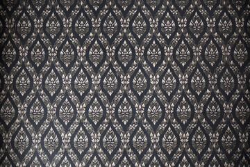 Thai style art ornament seamless pattern wallpaper, depict lotus flower background, Black and white design on the wall at temple in Thailand.