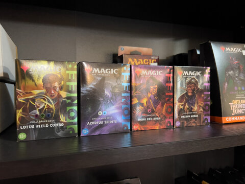 Bothell, WA USA - circa April 22, 2024: Close up of a variety of Magic the Gathering card decks for sale inside a board game cafe.