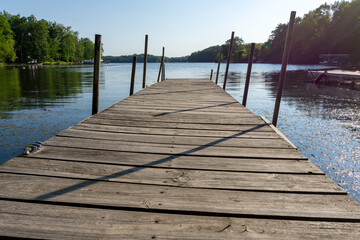 Looking down a pier on a  lake in northern Wisconsin.