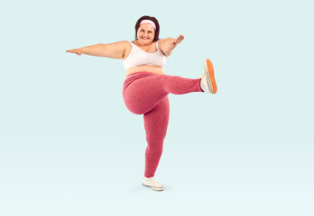 Happy overweight woman doing weight loss fitness workout. Joyful young fat lady in white sports bra...