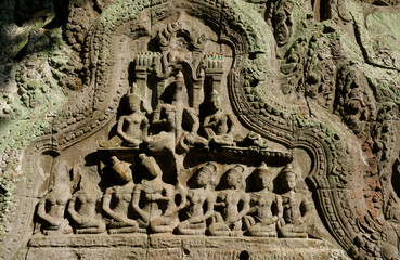 Fototapeta premium A bas-relief over an entrance at Ta Prohm temple in Siem Reap, Cambodia