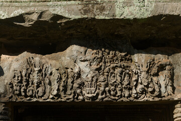 A bas-relief over an entrance at Ta Prohm temple in Siem Reap, Cambodia