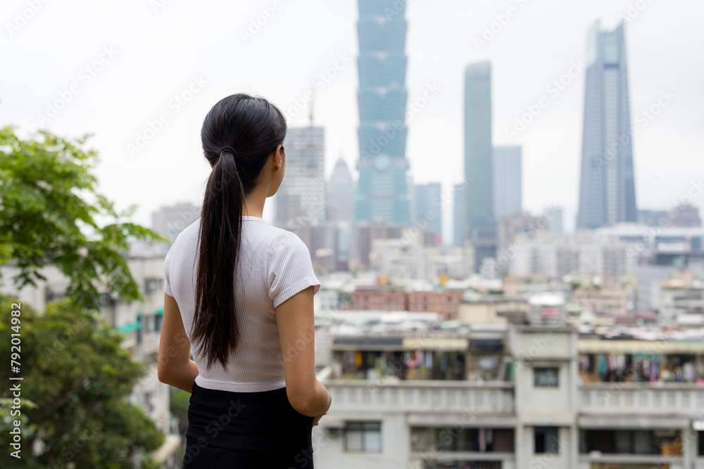 Poster woman enjoy the city view in taipei city