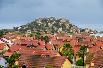 complex of houses with red roofs against the backdrop of the sea in Northern Cyprus 19