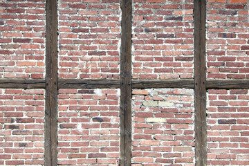 red and brown half-timbered wall with bricks
