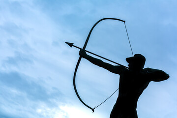 Archer Statue Against Blue Background: 4K Image
