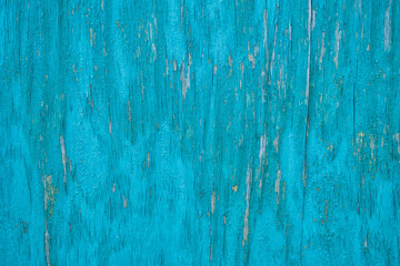 Texture of an old sheet of plywood covered with blue paint.