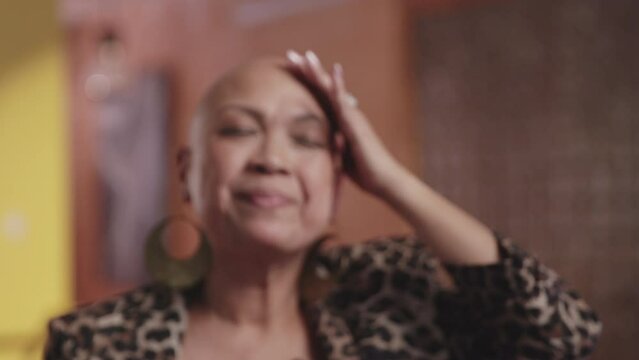 Woman with alopecia gets emotional after taking off her wig during an interview