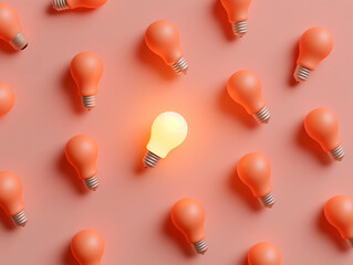 One glowing light bulb among many turned off orange bulbs on a pink background. Concept of idea, uniqueness, and creativity. Design for poster, banner, and background with copy space. Flat lay composi