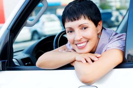 Smiling senior woman in a car