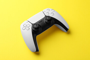 One wireless game controller on yellow background
