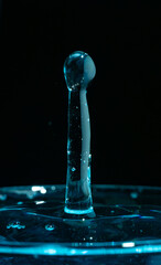 Water drop closeups while drops falling down and splashing into water in Jena