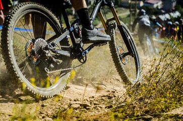 Detail shot of a cyclist descending down a mountain in a race.