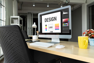 Graphic designer software for modern design of web page and commercial ads showing on the computer...