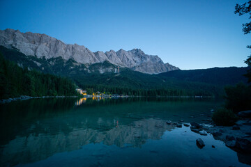 Lake eibsee at dusk with still water reflection