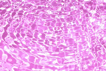 Concept of summer or background for cosmetic products presentation with pink water surface in swimming pool. Summer mockup idea. Copy space, top view