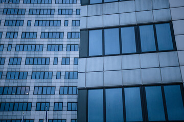 Windows of two tall office buildings.