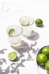 Margarita Soda Water Beverage Summertime Cocktail with Lime on Solid Bright White Background