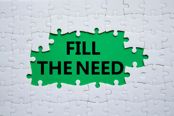 Fill the need symbol. Concept word Fill the need on white puzzle. Beautiful green background. Business and Fill the need concept. Copy space