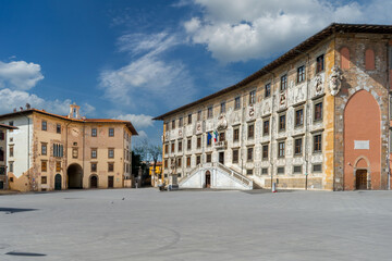 Pisa, Italy - April 05, 2024: Piazza dei Cavalieri with Palazzo della Carovana, home of the Scuola...